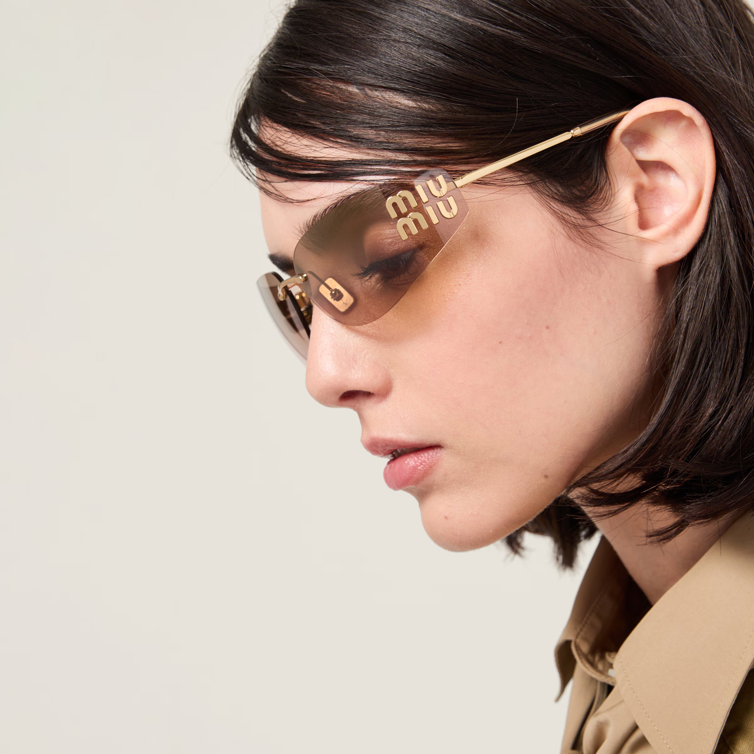 Lunettes de soleil MIU MIU MUZS Or